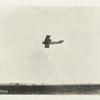 Lieut. T. E. Hibbon [?] firing a machine gun from an aeroplane, May 25, 1918.