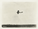 Lieut. T. E. Hibbon [?] firing a machine gun from an aeroplane, May 25, 1918.