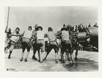 Ramming a shell into a disappearing gun.
