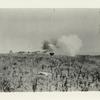 A disappearing gun in action. A half-ton shell is speeding on its way. It takes several million pounds pressure of gas to send it a great distance.