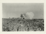 A disappearing gun in action. A half-ton shell is speeding on its way. It takes several million pounds pressure of gas to send it a great distance.