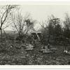 A captured German artillery position. The abandoned gun can be seen in the background. The ground around this position was plowed up by the Am. Barrage. Near Landreville, Ardennes, Nov. 7, 1918.