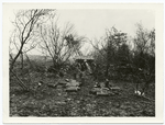 A captured German artillery position. The abandoned gun can be seen in the background. The ground around this position was plowed up by the Am. Barrage. Near Landreville, Ardennes, Nov. 7, 1918.