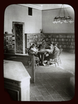 Children reading around table, corner of Circulation department, N.Y.P.L. Children's room, April 1913