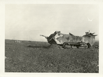 Large Am. tank which was wrecked by a direct hit from the German artillery just as it had reached a machine gun nest on the heights in front of Madeleine Ferme. In the foreground are the graves of the crew and in the background is a small tank that was wrecked. Near Madeleine Ferme, between Nautillois and Cunel, Meuse. Nov. 10, 1918.