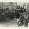 Capturing St. Mihiel salient, tank and trailer loaded with bicycles going forward. Refugees, 4 years under Gen. Yahe[??] crowd public sq. taken the late afternoon of 18th day of advance.