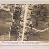 Vertical view taken from aeroplane showing movement of troops on the road to the right.
