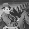 Jed Harris (in hat, in orchestra)