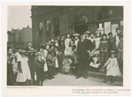 John Burns, newly appointed a member of the English cabinet, and the children of his employees. [courtesy of American Institute of Social Service]