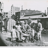 Group of freedmen, including children, gathered by a canal in Richmond, Virginia
