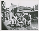Group of freedmen, including children, gathered by a canal in Richmond, Virginia