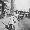 There are few playgrounds in Harlem. Negro children must play on the streets