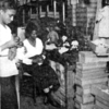 A Negro doll factory in Harlem which provides colored dolls for Negro children