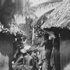 The entrance into  a Vai town of the "Femba" or women's devil