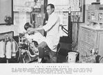 Dr. C. Jesse Davis, graduate of Meharry Medical College, Nashville, Tenn., in his dental suite in the Roosevelt Bank building at 35th Street and Grand Boulevard.