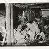 Life in the trenches. Scene at the S.O.T. camp, Fort Sheridan, Ill., showing interior of dugout and its occupants (11-1917).