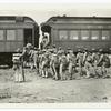 Troops in full gear boarding a train