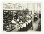 Manufacturing Colt's automatic pistols at Hartford, Connecticut. View of the inspection department. Stock room for rough parts. (4-1918)