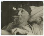 Joaquin Miller, "the Poet of the Sierras", photographed in bed in his home on "the Heights" at Fruitvale, California.