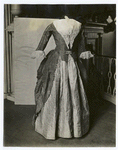 Costume, watered green silk overskirt, pink silk quilted petticoats; about 1810, from the Silsbee family. E.I.