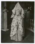 Costume -- White silk brocade with rose-pink quilted petticoat, worn by Mrs. Elias Hasket Derby, Salem, 1780-90. From Essex Inst.