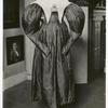 Costume, red taffeta silk, leg of mutton sleeves, low neck bodice, from Robbins family of Lexington, Mass. From Essex Inst.