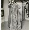 Costume, cloak, olive silk, worn by Mrs. Moses Adams, (Sarah Hubbard). Pumkin hood, quilted plum color silk, from Robbins family of Lexington, Mass.