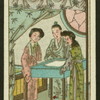 Three woman stand around table.