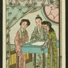 Three woman stand around table