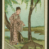 Woman feeds wild dog beside a river