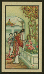 Woman tends bed of flowers