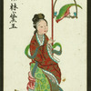 Woman in gown sitting beside parrot
