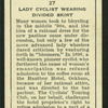Lady cyclist wearing divided skirt.