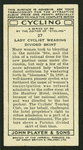 Lady cyclist wearing divided skirt.