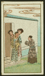 Man and two women talk to a woman on front step of a house