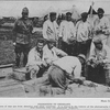 Prisoners in Germany; These prisoners of war are from America and other countries; It is stated in the history of the photographs that the two men shooting crap are American Negroes.