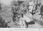 Both working for the Y.M.C.A.; Mr. Kelly and his colored driver at work during the last German offensive.