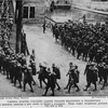 United States colored labor troops boarding a transport; An American Negro battalion entering a pier ready to board a transport.