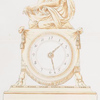 Empire style. Clock in bronze doré. Circular dial placed in the center of a swag of fringed material with tassels draped over goat's feet