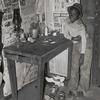 Corner of room of living quarters provided for Negro strawberry pickers near Independence, Louisiana, April 1939.