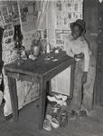 Corner of room of living quarters provided for Negro strawberry pickers near Independence, Louisiana, April 1939.