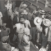 Negro day laborers brought in by truck from nearby towns, waiting to be paid off and buy supplies, for cotton picking inside plantation store, Friday night, Marcella Plantation, Mileston, Mississippi Delta, Mississippi, October 1939.