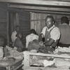 Negroes in bunkhouse in strawberry fields near Hammond, Louisiana; Note crude bunks, straw mattresses, and crowded conditions, April 1939.