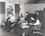 Plato's office staff for Wake and Midway Halls; Samuel Plato, contractor, and part of his office staff at their field headquarters for the construction of Wake and Midway Halls, now being completed for 1,000 Negro women war workers in Washington, D.C.; Left to right [clockwise]: Zelda S. Wilson, Mildred Dunn, Wilhelmena Barnett, Mrs. Elnora Plato (wife of the contractor and his chief accountant), Mr. Plato and Frances Purdy, March 1943.