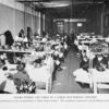 Negro women and girls in a large hat-making concern