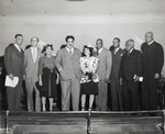 Members of the West Indies National Council and affiliated West Indian groups, with Albert Gomes (fourth from left), labor leader and Deputy-Mayor of Port-of-Spain, Trinidad, meeting at the Elks Imperial Hall, 160 West 129th Street, Harlem, to hear Gomes speak, 1946