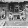 Cuban Negroes playing dominoes during their midday rest.