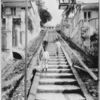 The four hills on which St. Thomas is built slope up from the harbour so steeply that flights of steps serve the purpose of streets, and wheeled vehicles can be used only along the waterfront.