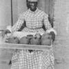 A fruit - seller, Port of Spain, Trinidad.