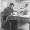 A Negro student in his room at Hampton.